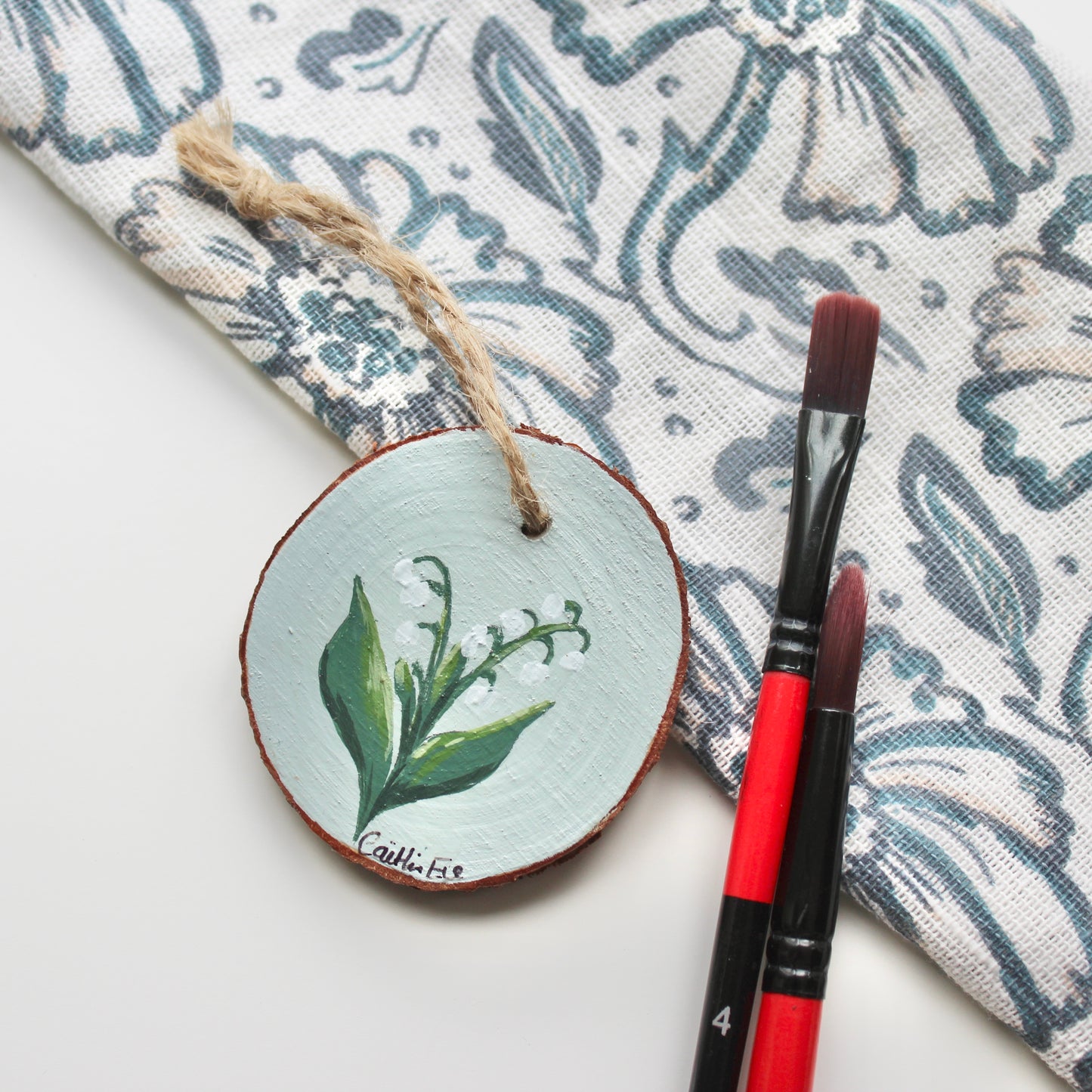 Hand-Painted Lily of the Valley Wood Slice with Twine, Original Floral Artwork, Rustic Home Decor, Unique Welsh decoration