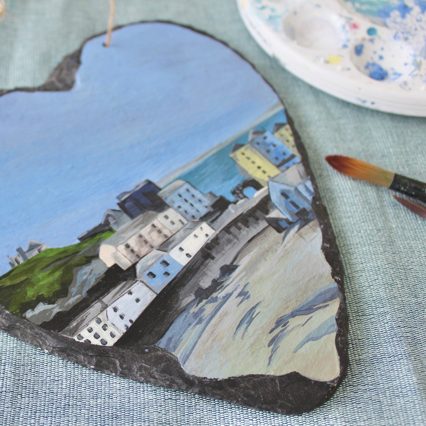 Tenby harbour painting on a decorative slate heart.