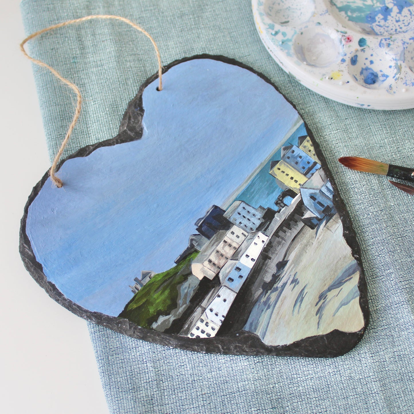 Tenby harbour painting on a decorative slate heart.